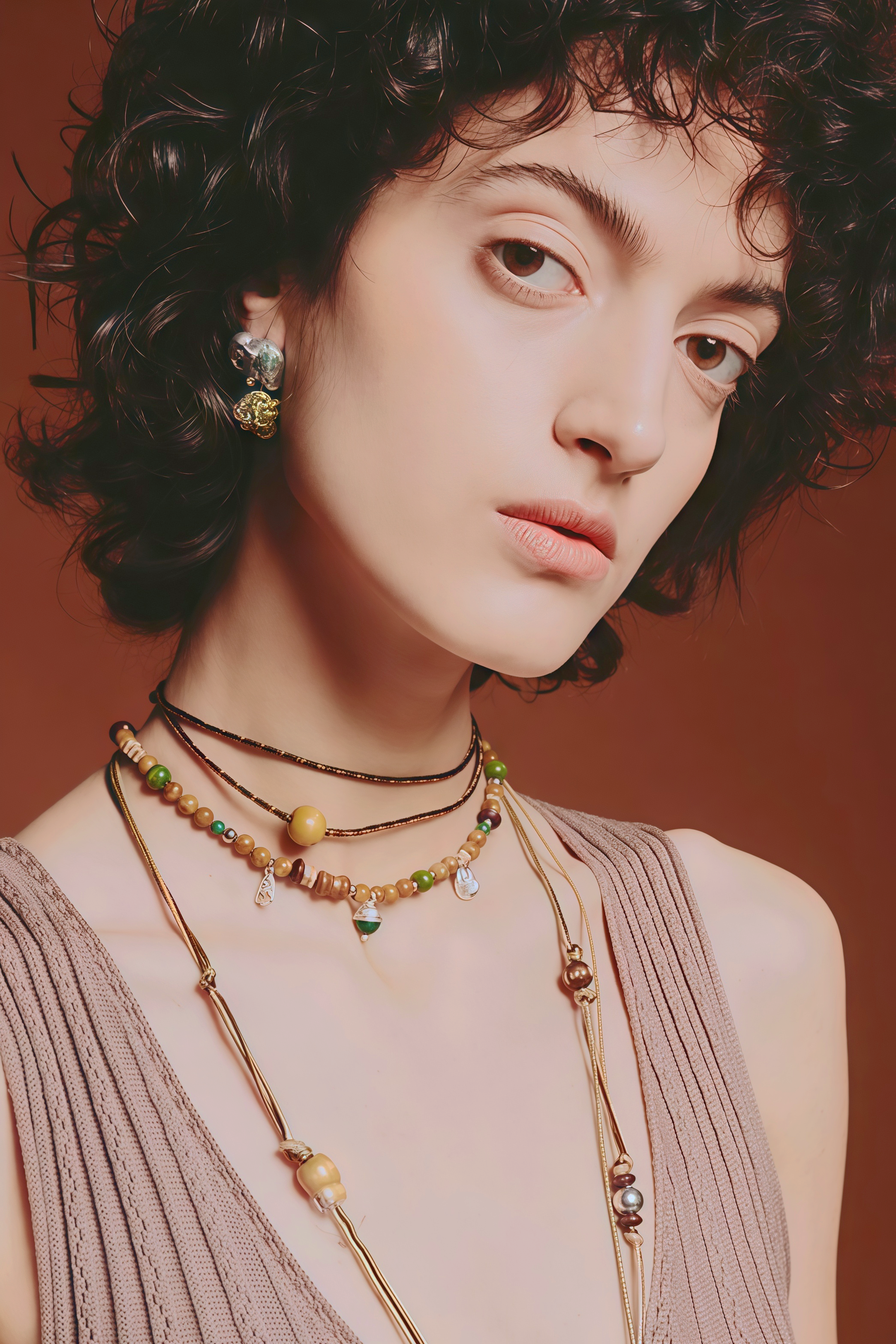 Trendy boho fashion jewelry featuring multi-layer stone necklaces on a young female model