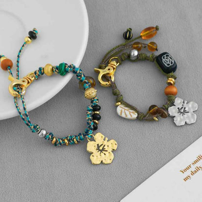 سوار سحر زهرة الكركديه مصنوع يدويًا - حبل بوهو مضفر من الخرز، قابل للتعديل، متوفر بخيارات ذهبية وفضية 