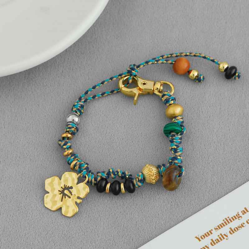 سوار سحر زهرة الكركديه مصنوع يدويًا - حبل بوهو مضفر من الخرز، قابل للتعديل، متوفر بخيارات ذهبية وفضية 