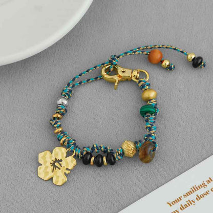 سوار سحر زهرة الكركديه مصنوع يدويًا - حبل بوهو مضفر من الخرز، قابل للتعديل، متوفر بخيارات ذهبية وفضية 