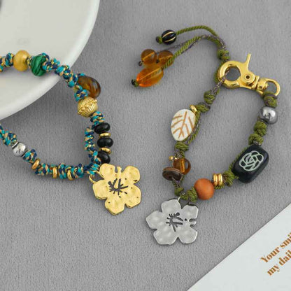 سوار سحر زهرة الكركديه مصنوع يدويًا - حبل بوهو مضفر من الخرز، قابل للتعديل، متوفر بخيارات ذهبية وفضية 